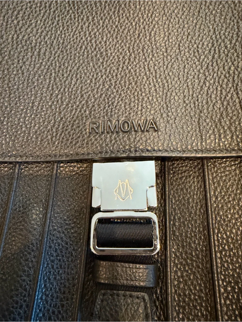 RIMOWA Black Leather Men's Backpack with Front Flap, used only once.